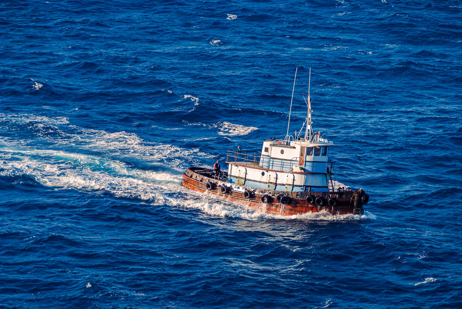 a small boat in a large body of water